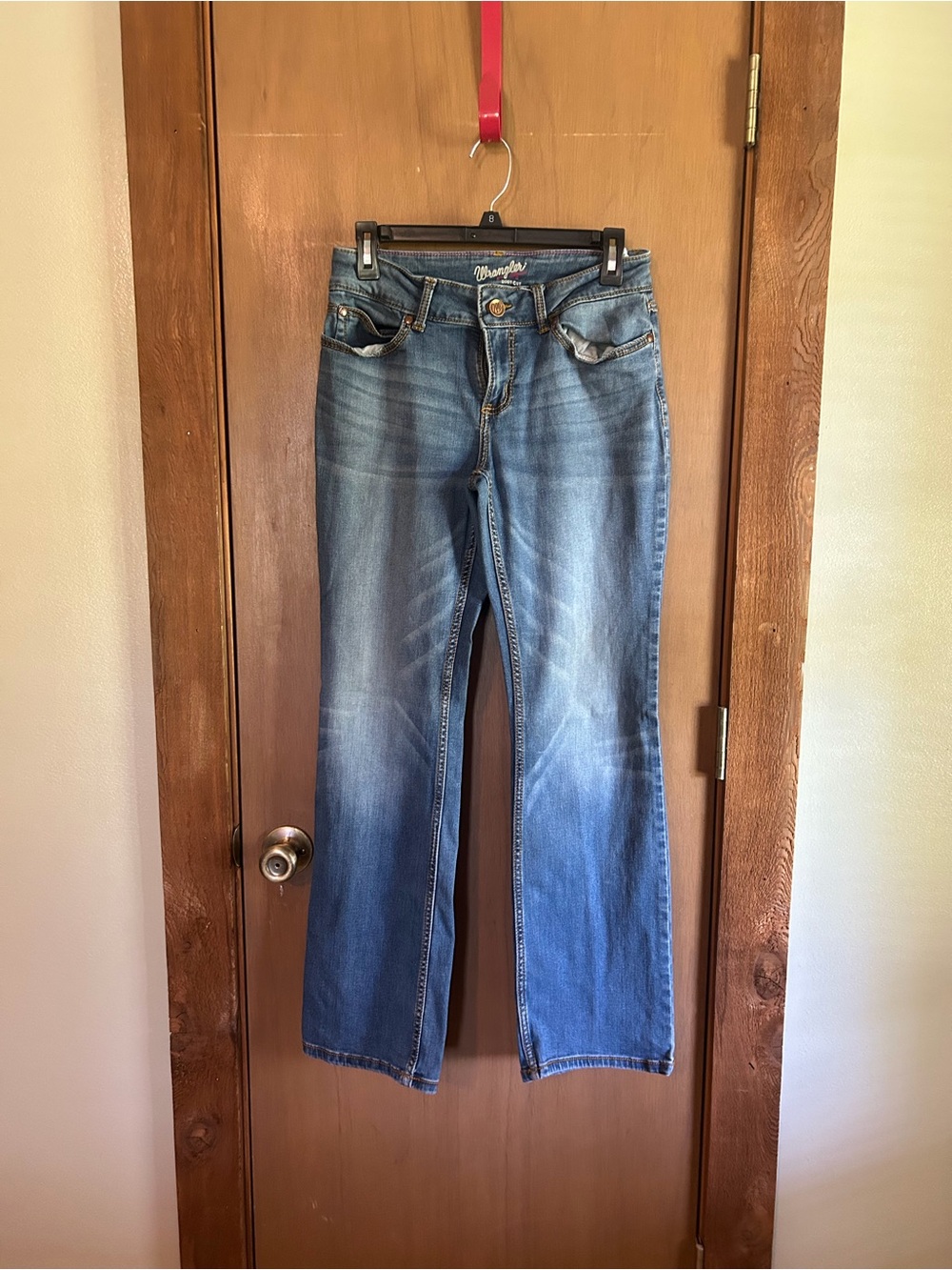 Wrangler Dark Blue Jeans with Pink Nail Accent